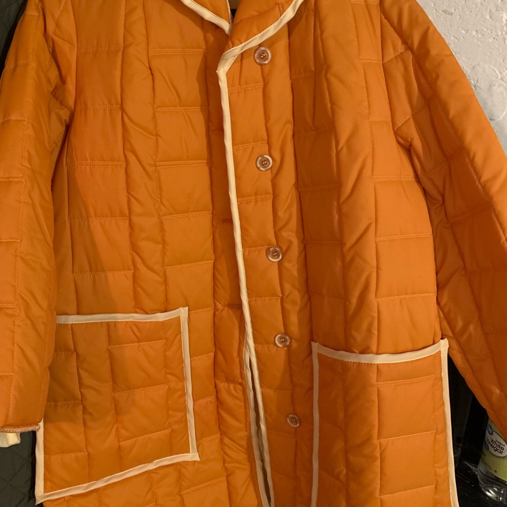 Vintage White Bear of St. Paul orange coat.